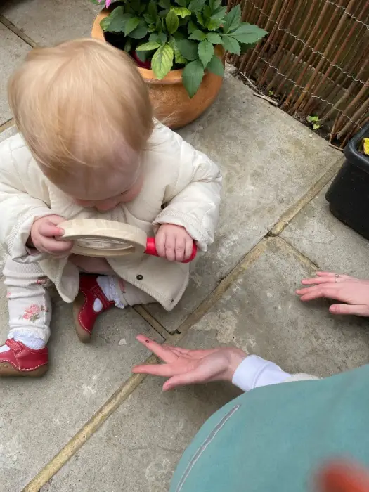 A child exploring on the garden patio